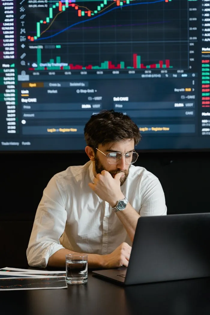 Analyst reviewing data dashboards on a laptop